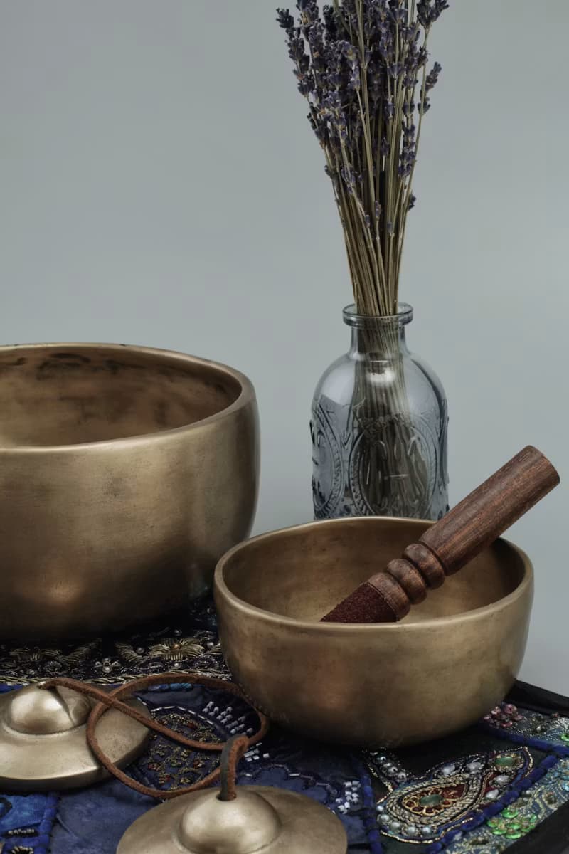 Singing bowls and dried lavender used in somatic therapy and trauma-sensitive yoga